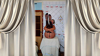 Hot housewife Lukerya flirts and changes clothes in the kitchen.